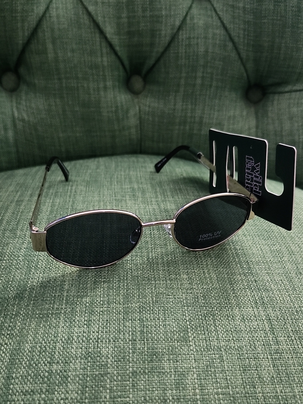 Oval Gold Frame Sunglasses with Dark Lenses